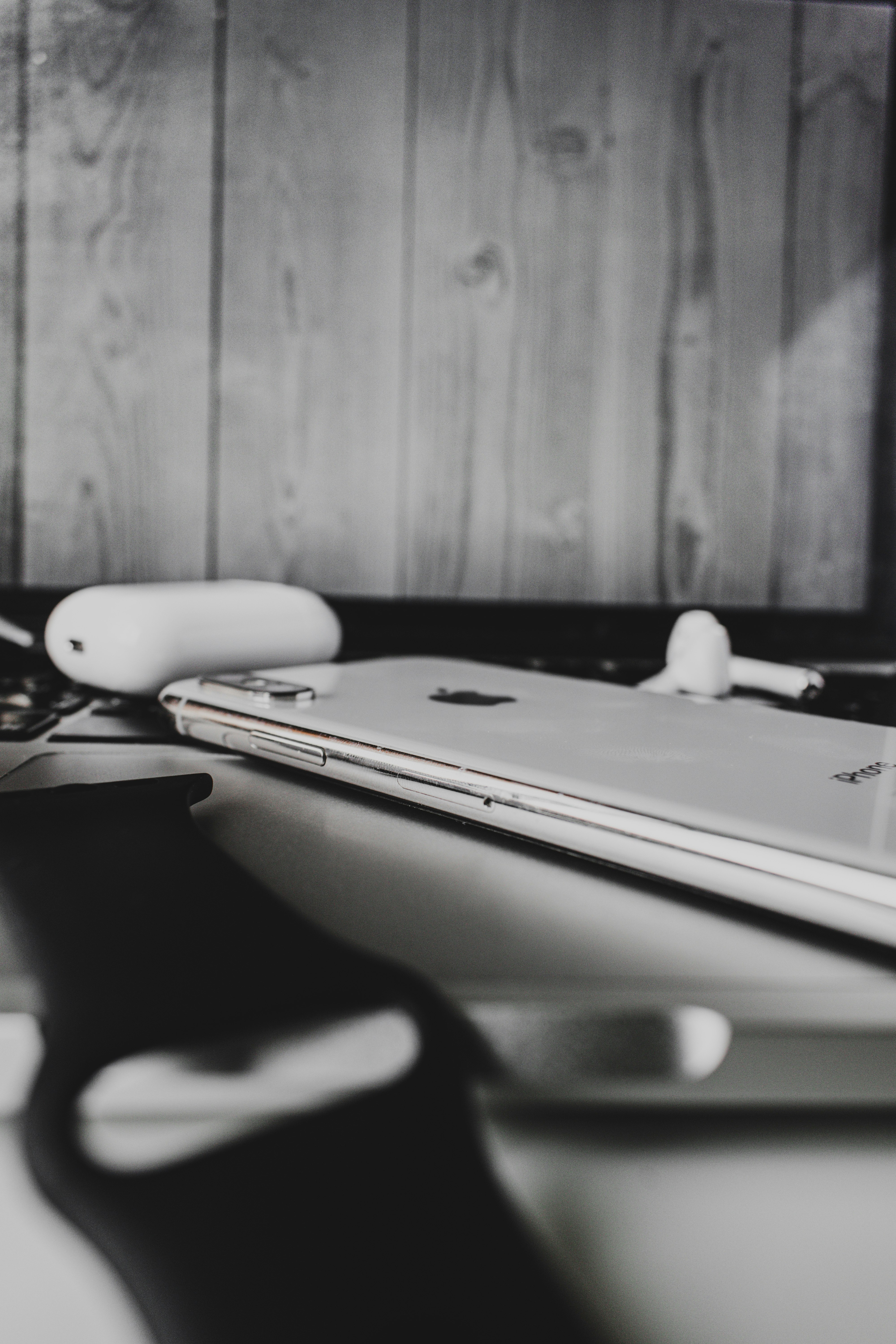 silver macbook on brown wooden table